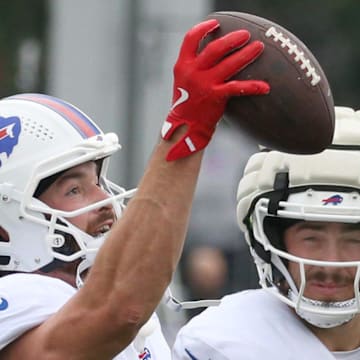 Bills tight end Dawson Knox eyes in a one-handed catch over Dalton Kincaid during position drills during day seven of Buffalo Bills training camp at St. John Fisher University Thursday, July 31, 2025 in Pittsford, NY. This was the first day Knox took part in camp with full pads on.