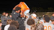 Oviedo High football players give head coach Greg Odierno a Gatorade bath after beating Evans, 29-28, in double overtime to win the Class 6A, District 4 championship. It was the Lions' fourth consecutive district title.