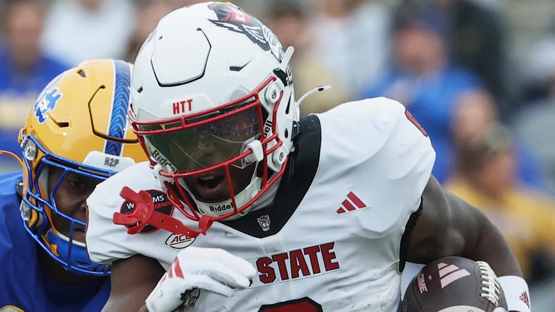 Oct 25, 2025; Pittsburgh, Pennsylvania, USA;  North Carolina State Wolfpack wide receiver Terrell Anderson (9) runs with the ball after a catch against the Pittsburgh Panthers during the first quarter at Acrisure Stadium. Mandatory Credit: Charles LeClaire-Imagn Images