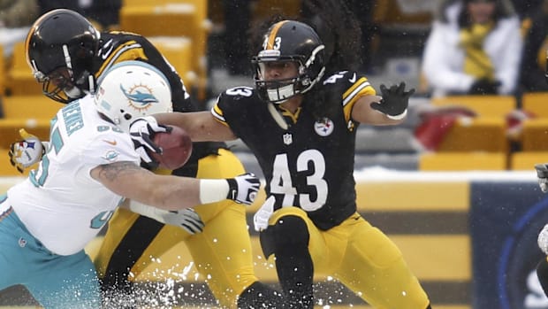Dec 8, 2013; Pittsburgh, PA, USA; Pittsburgh Steelers strong safety Troy Polamalu (43) runs with the ball after a missed Miam