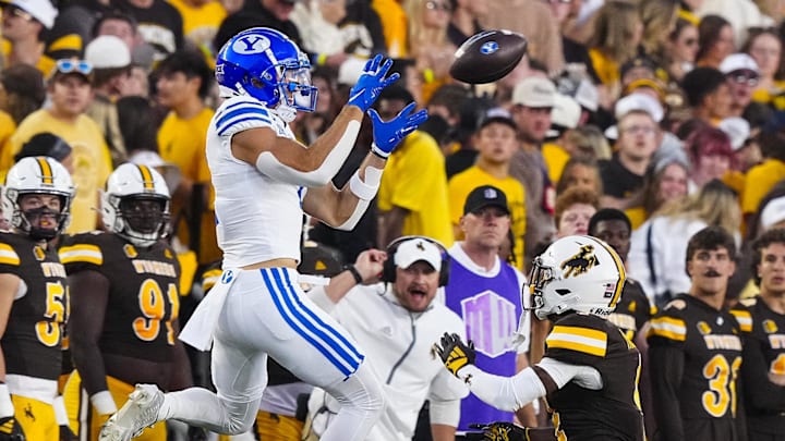 Sep 14, 2024; Laramie, Wyoming, USA; Brigham Young Cougars wide receiver Chase Roberts (2) makes a catch against the Wyoming Cowboys during the first quarter at Jonah Field at War Memorial Stadium.