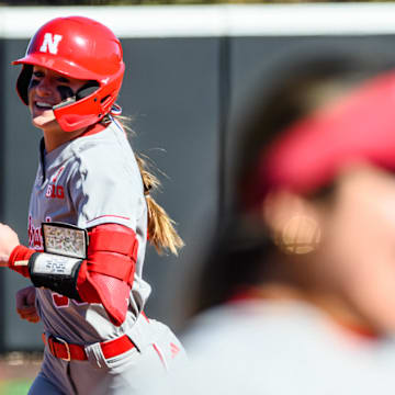 Jordy Bahl smiles as she runs the bases after a two-run homer.