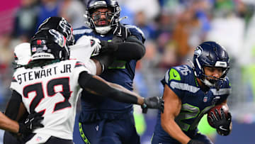 Oct 20, 2025; Seattle, Washington, USA; Seattle Seahawks running back Zach Charbonnet (26) runs the ball during the first quarter against the Houston Texans at Lumen Field. 