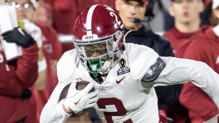 Dec 19, 2025; Norman, OK, USA; Alabama Crimson Tide defensive back Zabien Brown (2) returns an interception for a touchdown against the Oklahoma Sooners during the CFP National Playoff First Round at Gaylord Family Oklahoma Memorial Stadium. Mandatory Credit: Mark J. Rebilas-Imagn Images