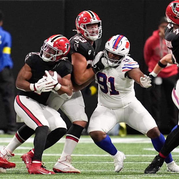 Atlanta Falcons running back Bijan Robinson is tackled by. Buffalo Bills defensive tackle Ed Oliver