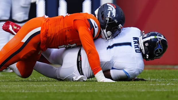 Denver Broncos linebacker Nik Bonitto (15) sacks Tennessee Titans quarterback Cam Ward (1) in the first half.