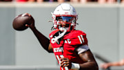 Oct 4, 2025; Raleigh, North Carolina, USA; NC State Wolfpack quarterback CJ Bailey (11) prepares to throw the ball during the first half of the game against Campbell Fighting Camels at Carter-Finley Stadium. Mandatory Credit: Jaylynn Nash-Imagn Images