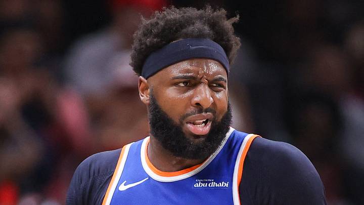 Apr 30, 2026; Atlanta, Georgia, USA; New York Knicks center Mitchell Robinson (23) is restrained by assistant coach Rick Brunson against the Atlanta Hawks in the second quarter during game six of the first round of the 2026 NBA Playoffs at State Farm Arena. Mandatory Credit: Brett Davis-Imagn Images