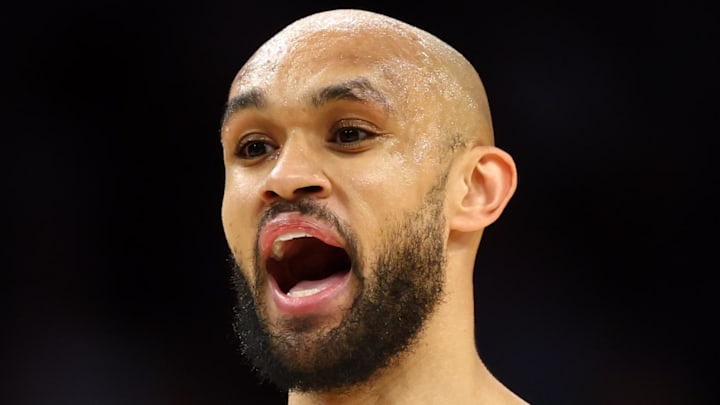 Feb 24, 2026; Phoenix, Arizona, USA; Boston Celtics guard Derrick White (9) against the Phoenix Suns at Mortgage Matchup Center. Mandatory Credit: Mark J. Rebilas-Imagn Images