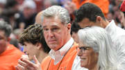 Miami Athletic Director Dan Radakovich claps after his team beat University of Southern California during the second half of the NCAA Div. 1 Men's Basketball Tournament preliminary round game at Bon Secours Wellness Arena in Greenville, S.C. Friday, March 18, 2022.

Ncaa Men S Basketball First Round Auburn Vs Jacksonville State