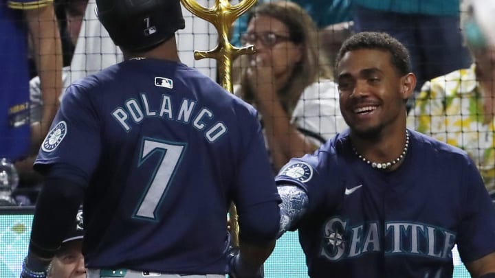 Seattle Mariners designated hitter Julio Rodriguez (right) hands second baseman Jorge Polanco (7) the trident after Polanco hit a solo home run against the Pittsburgh Pirates during the ninth inning at PNC Park. Pittsburgh won 5-3 on Aug 16.