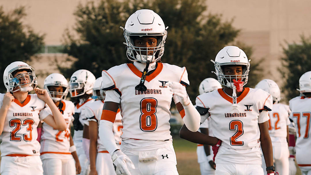 Adrian Peterson Jr. (8) is making headlines already as a 14-year-old. Son of former NFL MVP running back Adrian Peterson.