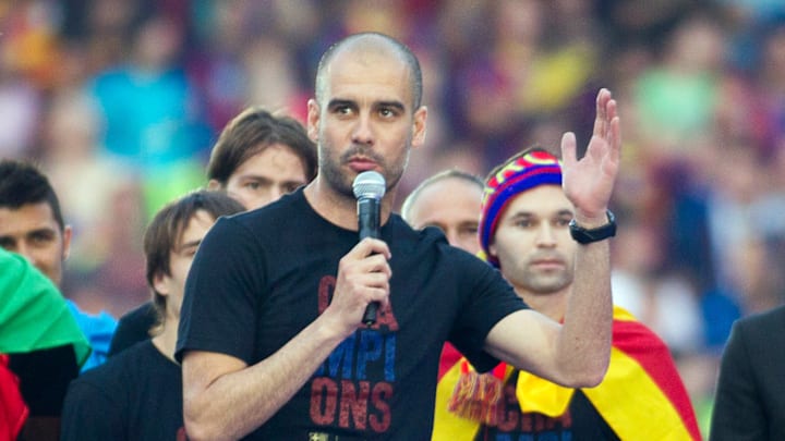 Barcelona's coach Pep Guardiola delivers
