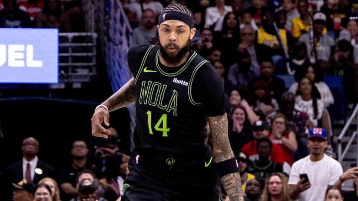 Apr 14, 2024; New Orleans, Louisiana, USA; New Orleans Pelicans forward Brandon Ingram (14) brings the ball up court against the Los Angeles Lakers during the first half at Smoothie King Center.