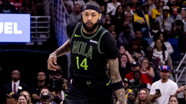 Apr 14, 2024; New Orleans, Louisiana, USA; New Orleans Pelicans forward Brandon Ingram (14) brings the ball up court against the Los Angeles Lakers during the first half at Smoothie King Center.