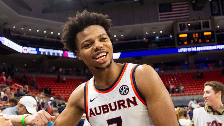 Auburn Tigers forward Keyshawn Hall (7) high fives fans after the game as Auburn Tigers take on Arkansas Razorbacks at Neville Arena in Auburn, Ala. on Saturday, Jan. 10, 2026. Auburn Tigers defeated Arkansas Razorbacks 95-73.