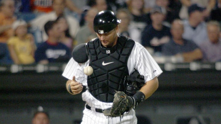 Chicago White Sox catcher #12 AJ Pierzynski reacts after two runs scored on Lew Ford's single in the 4th inning against at US Cellular Field in 2005.