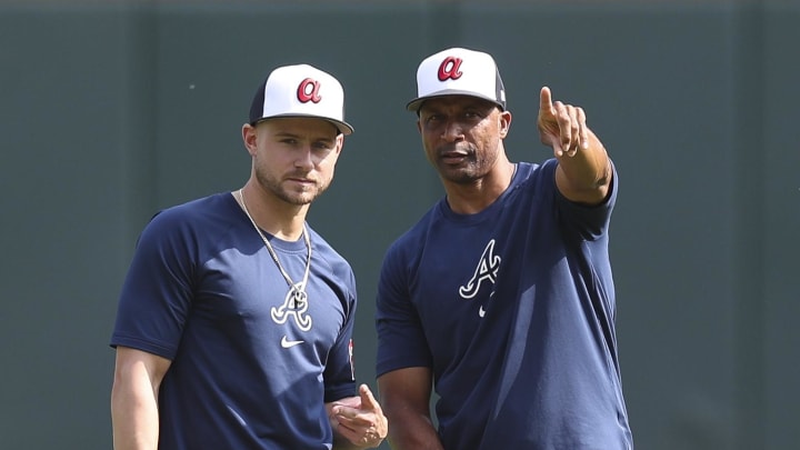 Atlanta Braves closer Raisel Iglesias, seen here talking to leftfielder Jarred Kelenic, was not used in the 9th inning of last night's walkoff loss to the Seattle Mariners. 
