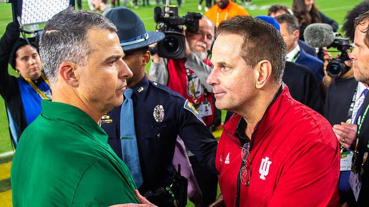 Indiana Head Coach Curt Cignetti and Miami Head Coach Mario Cristobal shake hands after the College Football Playoff National Championship college football game at Hard Rock Stadium in Miami Gardens on Monday, Jan. 19, 2026.
