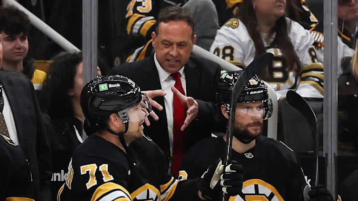 Oct 28, 2025; Boston, Massachusetts, USA; Boston Bruins head coach Marco Sturm talks with left wing Viktor Arvidsson (71) during the second period against the New York Islanders at TD Garden. Mandatory Credit: Winslow Townson-Imagn Images