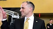 Iowa head men's basketball coach Ben McCollum high-fives Jan Jensen, the head women's basketball coach, after his introductory press conference Tuesday, March 25, 2025 at Carver-Hawkeye Arena in Iowa City, Iowa.