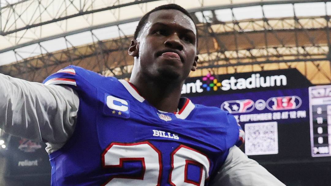 Buffalo Bills safety Sam Franklin Jr. high fives fans while exiting the field after the game against the Houston Texans.