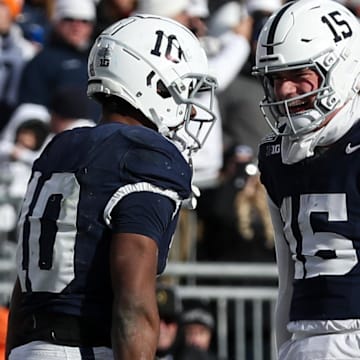 Penn State Nittany Lions running back Nicholas Singleton (10) celebrates with quarterback Drew Allar (15) after scoring a touchdown vs. SMU in the College Football Playoff.