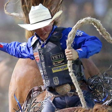 Saddle bronc rider Stetson Wright, of Milford, UT, rides a horse named Honeymoon during the Kitsap Stampede on Wednesday, August 25, 2021.

Standalone For Print Stampede 08
