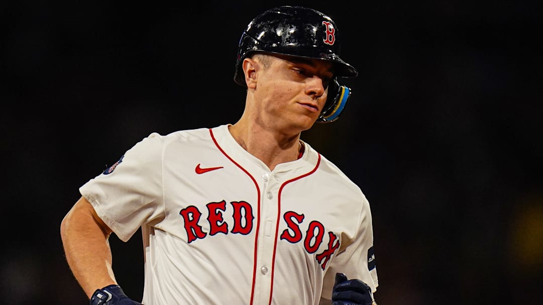 Sep 9, 2024; Boston, Massachusetts, USA; Boston Red Sox designated hitter Tyler O'Neill (17) hits a home run against the Baltimore Orioles in the third inning at Fenway Park. Mandatory Credit: David Butler II-Imagn Images
