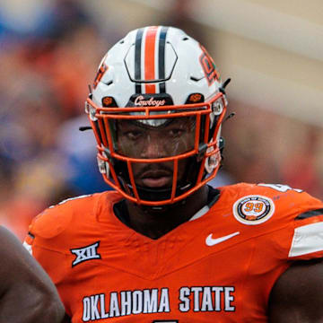 Aug 31, 2024; Stillwater, Oklahoma, USA; Oklahoma State Cowboys linebacker Nick Martin (4) ready for a play during the fourth quarter against the South Dakota State Jackrabbits at Boone Pickens Stadium. Mandatory Credit: William Purnell-Imagn Images