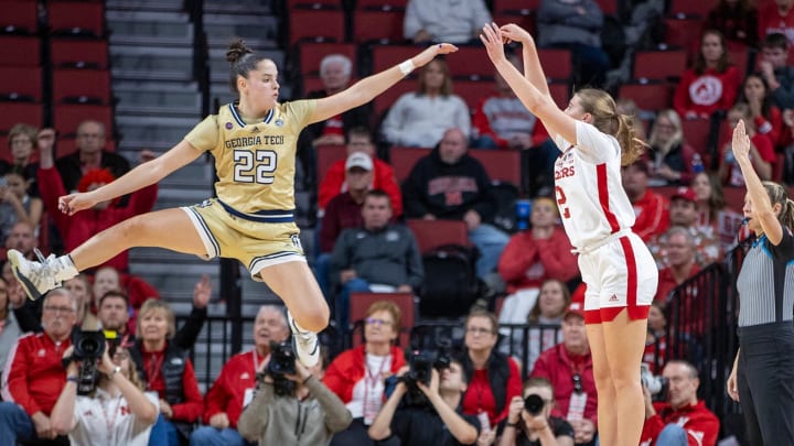 Dec. 2, 2023 LINCOLN - Nebraska guard Logan Nissley shoots over Georgia Tech guard Inés Noguero at Pinnacle Bank Arena.