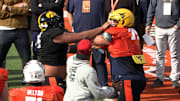 Yahya Black of Iowa and Wyatt Milum of West Virginia go at it at Reese's Senior Bowl practice on Day 1 in Mobile, Ala.