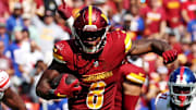 Sep 15, 2024; Landover, Maryland, USA; Washington Commanders running back Brian Robinson Jr. (8) runs the ball during the third quarter against the New York Giants at Commanders Field. Mandatory Credit: Peter Casey-Imagn Images