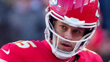 Dec 21, 2024; Kansas City, Missouri, USA; Kansas City Chiefs quarterback Patrick Mahomes (15) talks with head coach Andy Reid during the second half against the Houston Texans at GEHA Field at Arrowhead Stadium. 