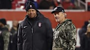 Nov 12, 2022; Salt Lake City, Utah, USA; Stanford Cardinal head coach David Shaw (left) and Utah Utes head coach Kyle Whittingham (right) speak prior to a game at Rice-Eccles Stadium. Mandatory Credit: Rob Gray-Imagn Images