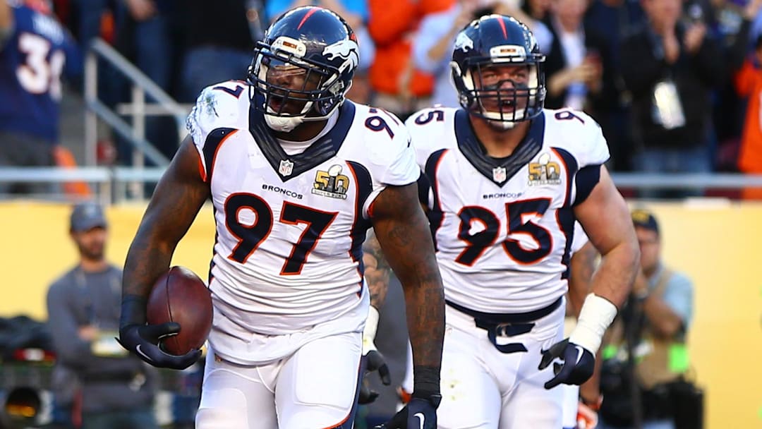 Feb 7, 2016; Santa Clara, CA, USA; Denver Broncos defensive tackle Malik Jackson (97) and defensive end Derek Wolfe (95) celebrate a first quarter defensive touchdown against the Carolina Panthers in Super Bowl 50 at Levi's Stadium. Mandatory Credit: Mark J. Rebilas-Imagn Images
