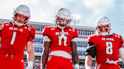 Oct 4, 2025; Raleigh, North Carolina, USA; NC State Wolfpack quarterback CJ Bailey (11), linebacker Caden Fordham (1), wide receiver Keenan Jackson (8) during the coin toss prior to the first half of the game against Campbell Fighting Camels at Carter-Finley Stadium. Mandatory Credit: Jaylynn Nash-Imagn Images