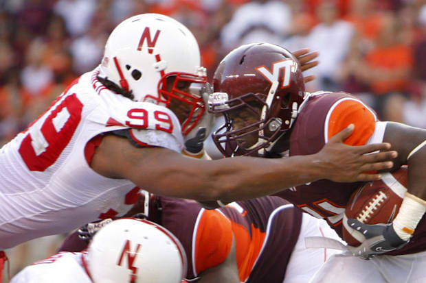 Virginia Tech tailback David Wilson is tackled by Nebraska defensive end Barry Turner in 2009.