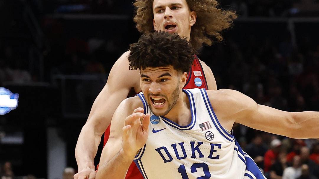 Mar 27, 2026; Washington, DC, USA; Duke Blue Devils forward Cameron Boozer (12) dribbles the ball past St. John's Red Storm forward Ruben Prey (17) in the second half during a Sweet Sixteen game of the East Regional of the men's 2026 NCAA Tournament at Capital One Arena. Mandatory Credit: Geoff Burke-Imagn Images