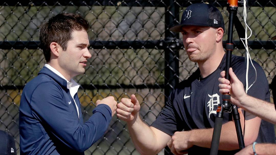 Tigers president of baseball operations Scott Harris fist-bumps pitcher Tarik Skubal during bullpen sessions. 