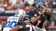 Oct 27, 2024; Houston, Texas, USA; Houston Texans quarterback C.J. Stroud (7) is sacked by Indianapolis Colts defensive tackle DeForest Buckner (99) in the second quarter at NRG Stadium. Mandatory Credit: Thomas Shea-Imagn Images