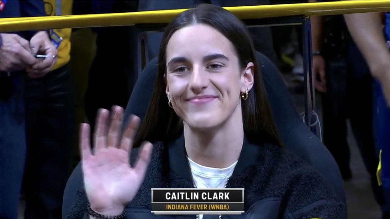 Caitlin Clark waves to the crowd