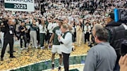 Michigan State head coach Tom Izzo and guard Tre Holloman celebrate the Spartans' Big Ten championship.