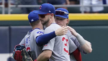 Chicago Cubs outfielder Ian Happ (8), outfielder Pete Crow-Armstrong (4), and outfielder Kyle Tucker (30) celebrate their win against the Chicago White Sox at Rate Field on July 27.