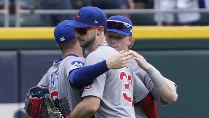 Chicago Cubs outfielder Ian Happ (8), outfielder Pete Crow-Armstrong (4), and outfielder Kyle Tucker (30) celebrate their win against the Chicago White Sox at Rate Field on July 27.