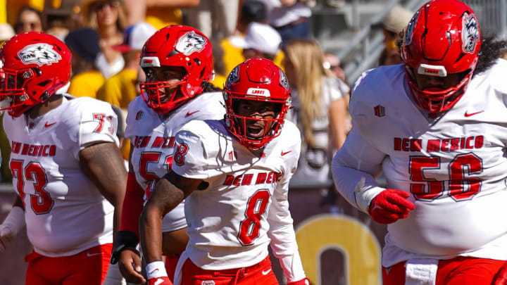 Sep 30, 2023; Laramie, Wyoming, USA; New Mexico Lobos wide receiver Jeremiah Hixon (8) celebrates a touchdown against the Wyoming Cowboys during the first quarter at Jonah Field at War Memorial Stadium. Mandatory Credit: Troy Babbitt-USA TODAY Sports

