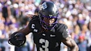 Nov 23, 2024; Fort Worth, Texas, USA; TCU Horned Frogs wide receiver Savion Williams (3) runs the ball against the Arizona Wildcats in the first quarter at Amon G. Carter Stadium.