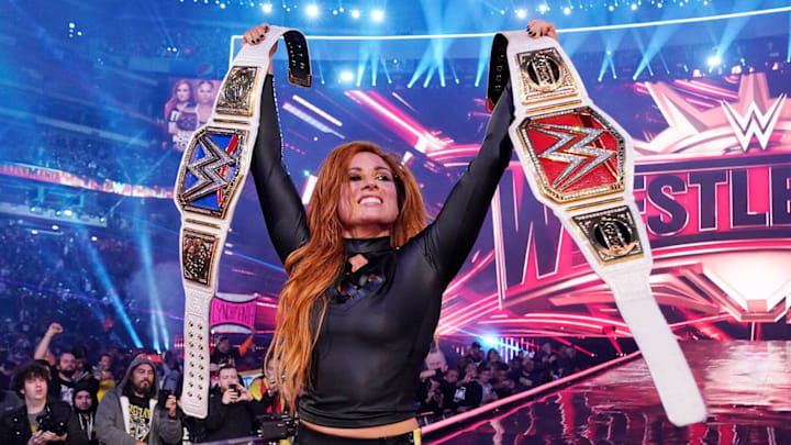 Becky Lynch celebrates after her historic win in the main event of WrestleMania 35