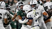 Michigan State's Jalen Thompson tackles Penn State's Kaytron Allen last week in East Lansing.
