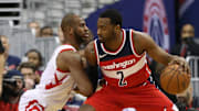 Dec 29, 2017; Washington, DC, USA; Washington Wizards guard John Wall (2) dribbles the ball as Houston Rockets guard Chris Paul (3) defends in the first quarter at Capital One Arena. Mandatory Credit: Geoff Burke-Imagn Images